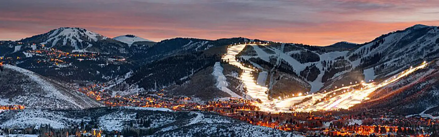 Park City ski runs lit at dusk